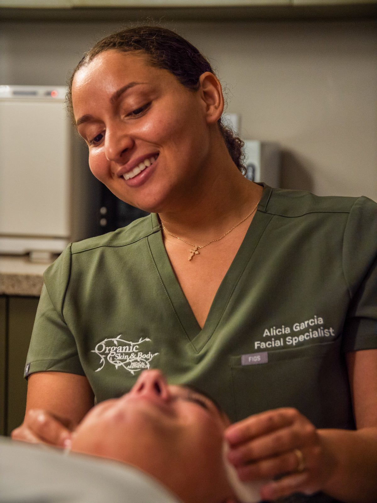 Organic Skin and Body facial specialist with a client during a facial at the Bradenton med spa